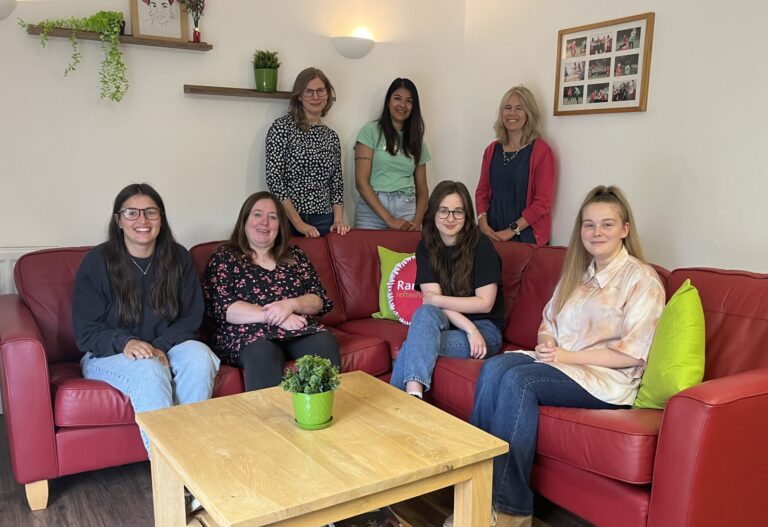 Support team sat on the sofa