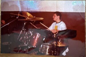 Young Craig playing the drums
